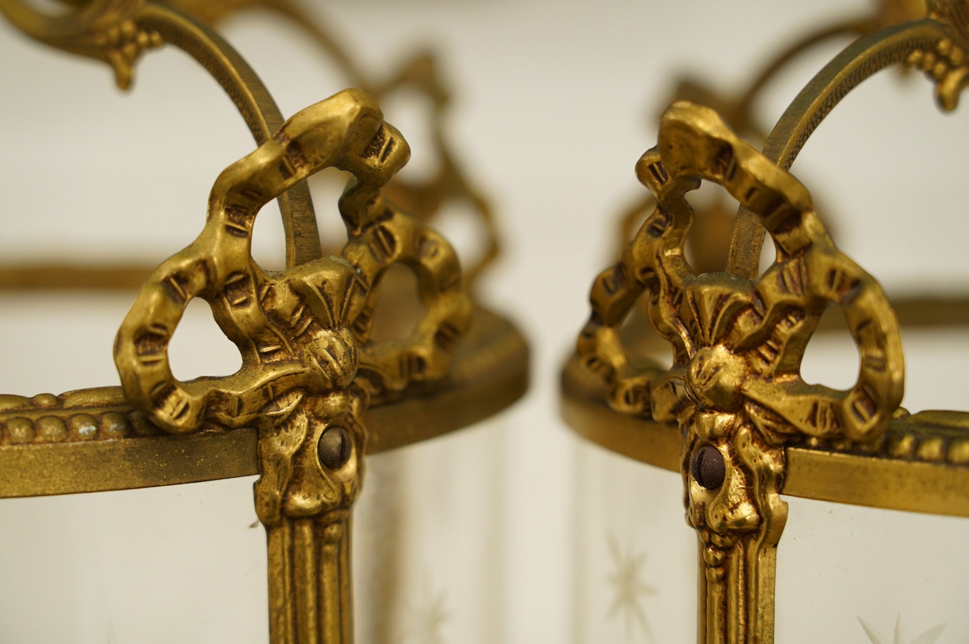 A pair of Louis XVI style gilt metal hall lanterns, 40cm high. Condition - fair to good